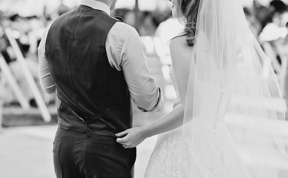 Free Image of Newlyweds holding hands during ceremony 