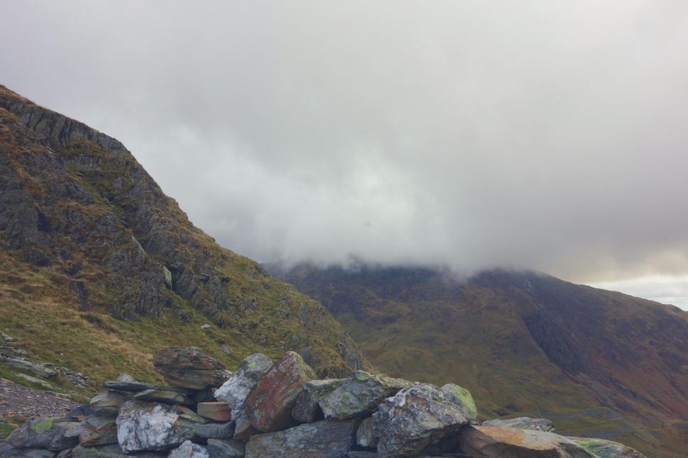 Free Image of Misty mountain landscape with cloudy skies 