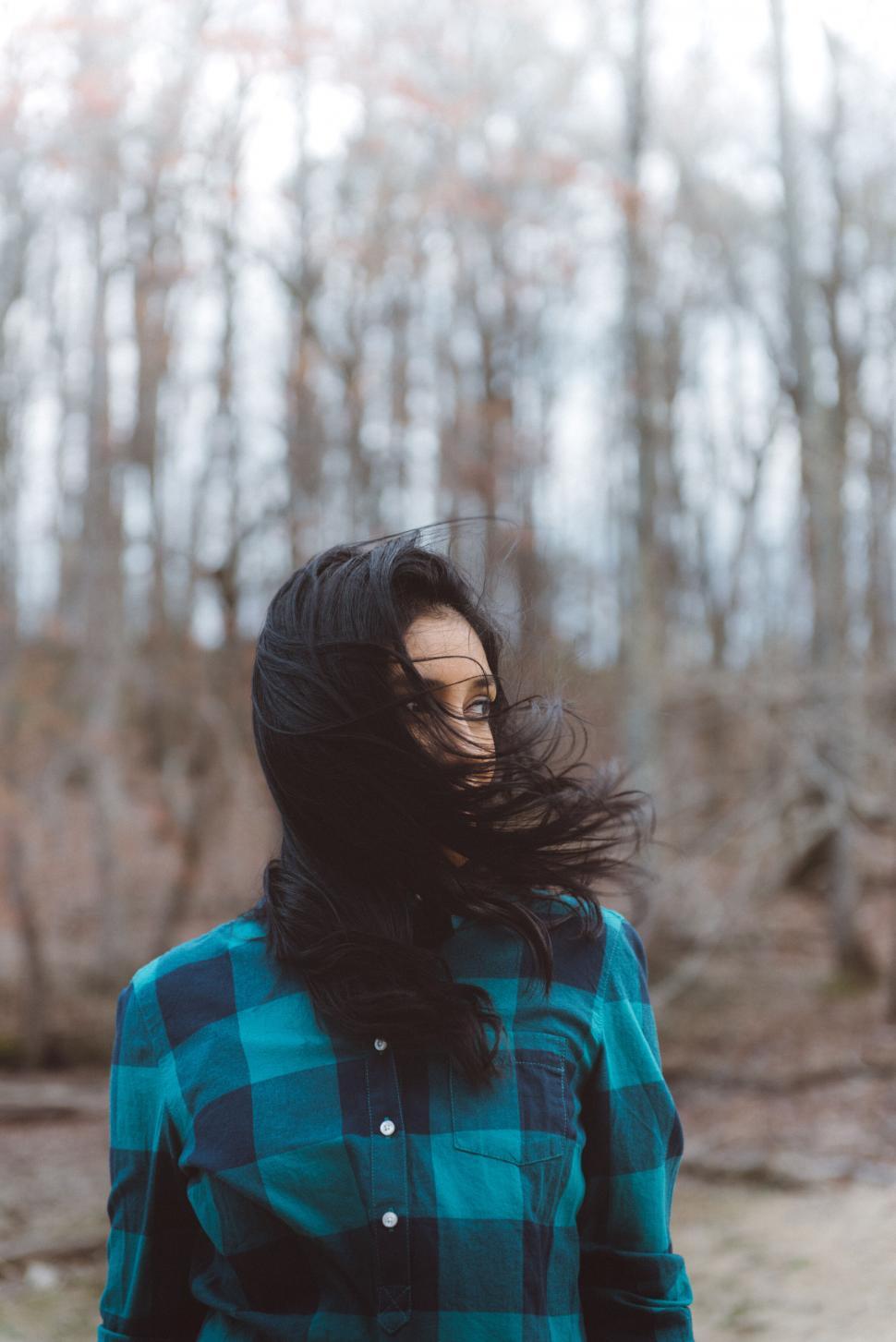 Free Image of Solitary Woman Against Autumn Forest Background 