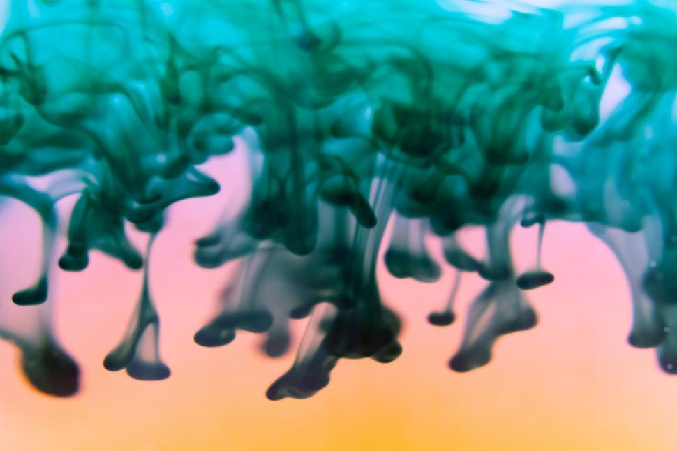 Free Image of Vibrant green ink plumes in water 