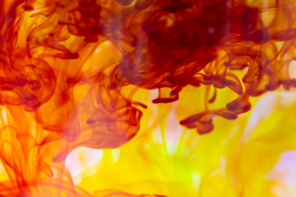 Free Image of Vibrant orange and red ink diffusion 