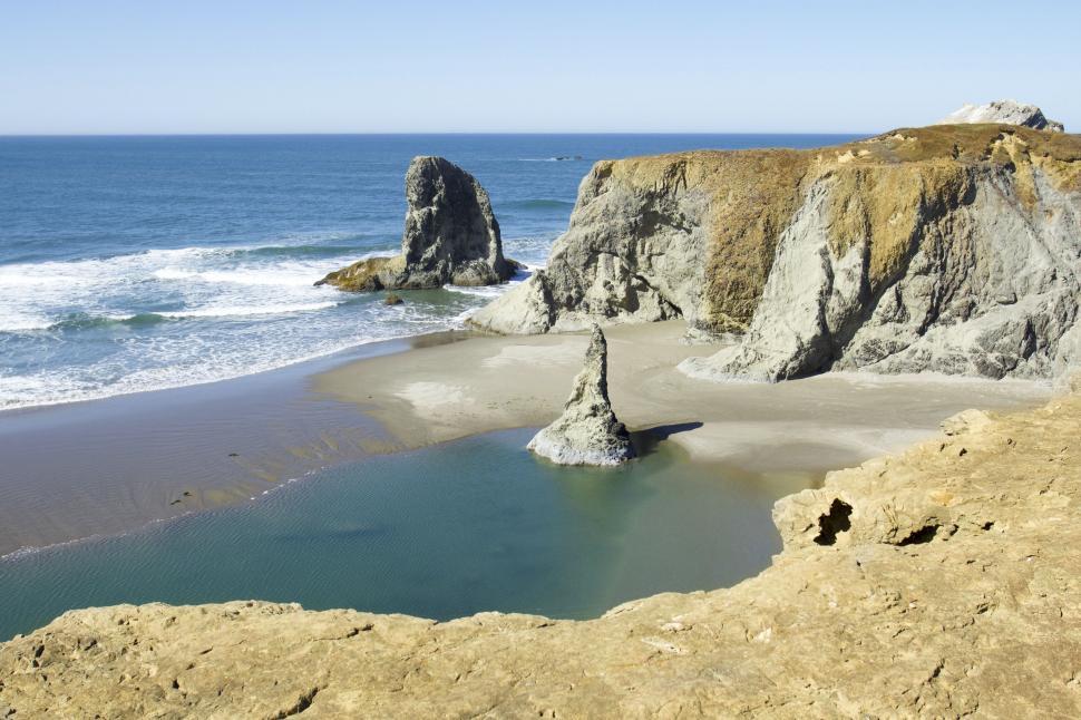 Free Image of Serene coastal landscape with rocky formations 