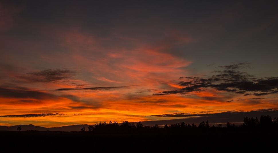 Free Image of Fiery sunset over silhouette landscape 