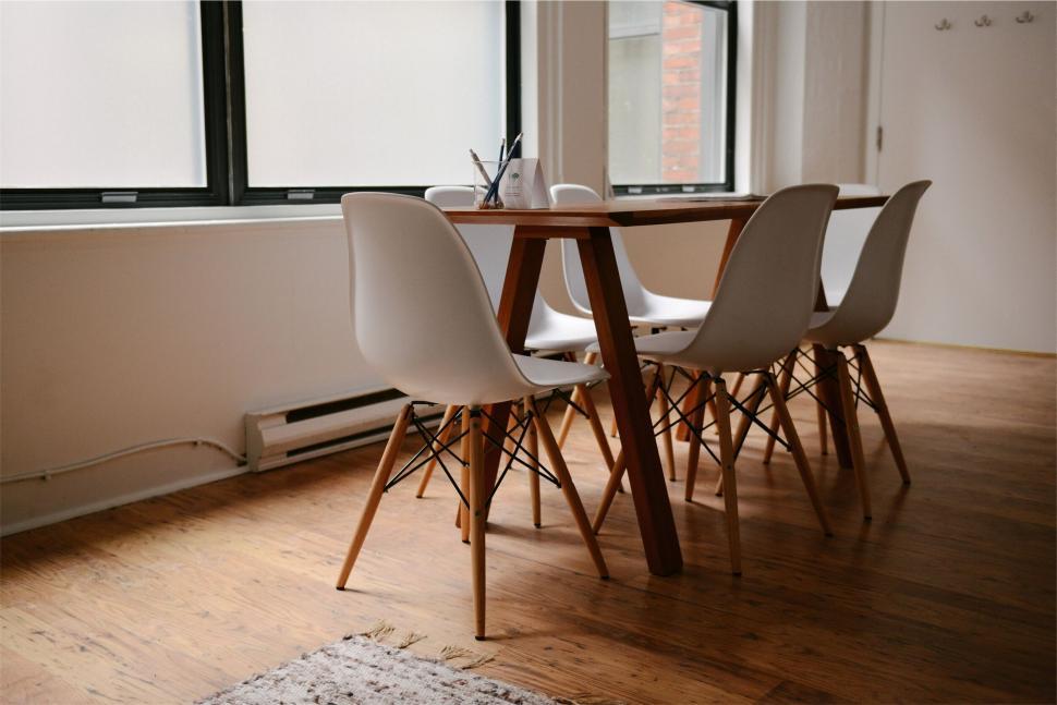 Free Image of Elegant dining setup with mid-century chairs 