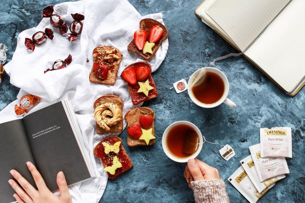 Free Image of Flat lay of cozy reading and snack time 