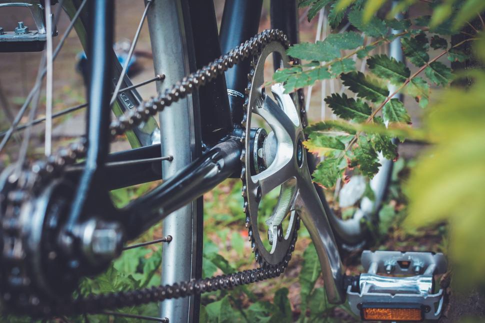Free Image of Close-up of a bicycle chain and gears 