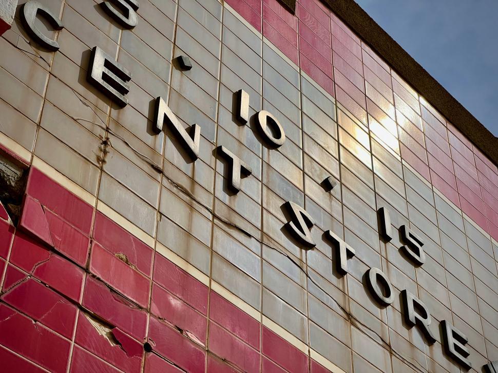 Free Image of Bold typography on a retro pink tiled wall 