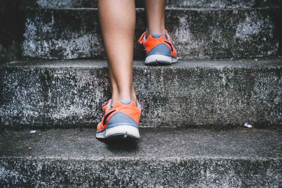 Free Image of Close-up of feet walking up stairs 