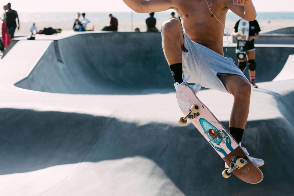 Free Image of Skateboarder mid-air at skatepark action 
