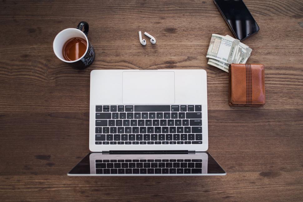 Free Image of Work essentials arranged on a wooden desk 