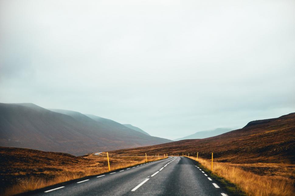Free Image of Open road in a scenic barren landscape 