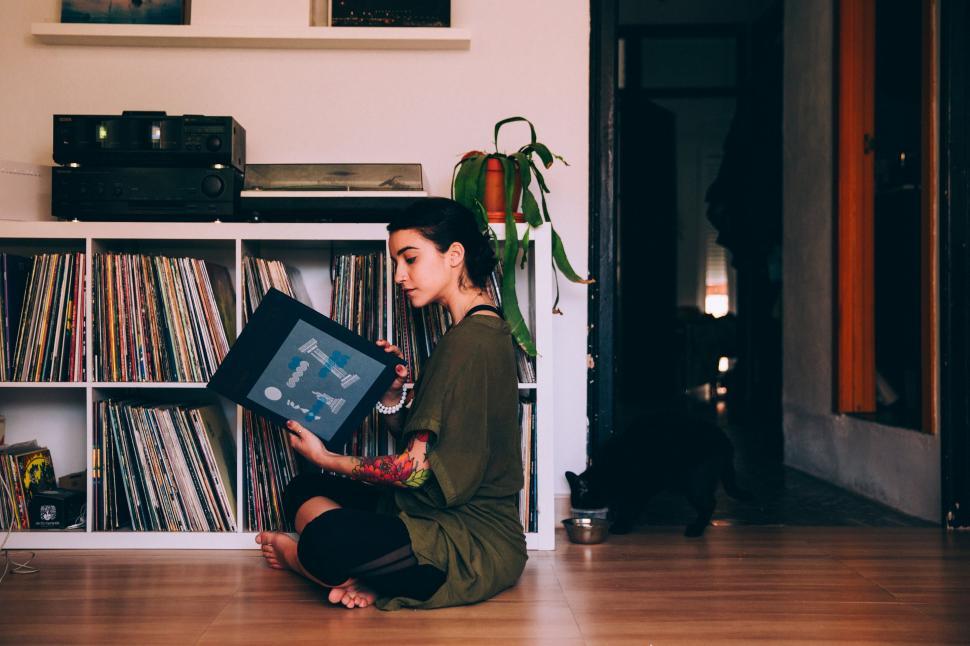 Free Image of Woman browsing vinyl records 