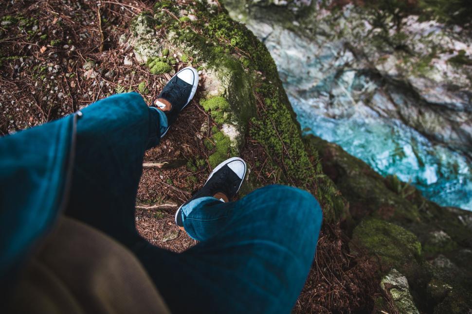Free Image of Person standing on edge looking down 