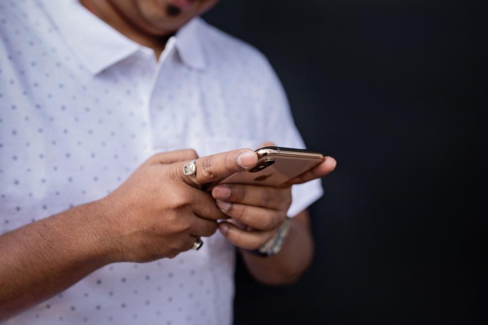 Free Image of Close-up of hands texting on smartphone 