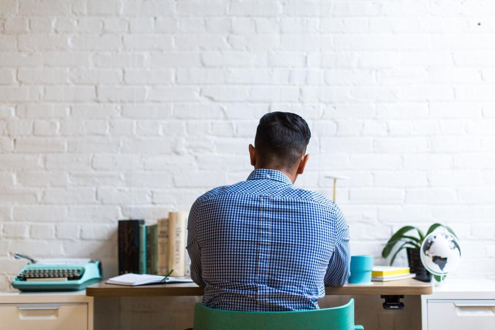 Free Image of Man working in a modern home office space 