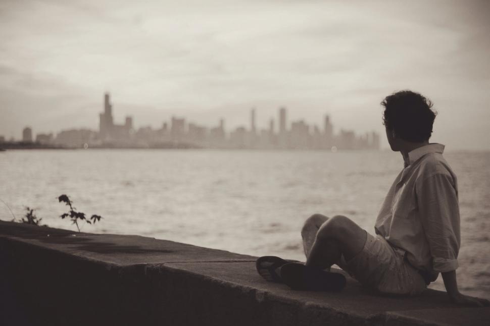 Free Image of Man overlooking city skyline from a distance 