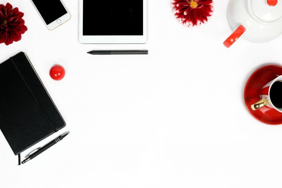 Free Image of Elegant workspace with tech gadgets and tea 