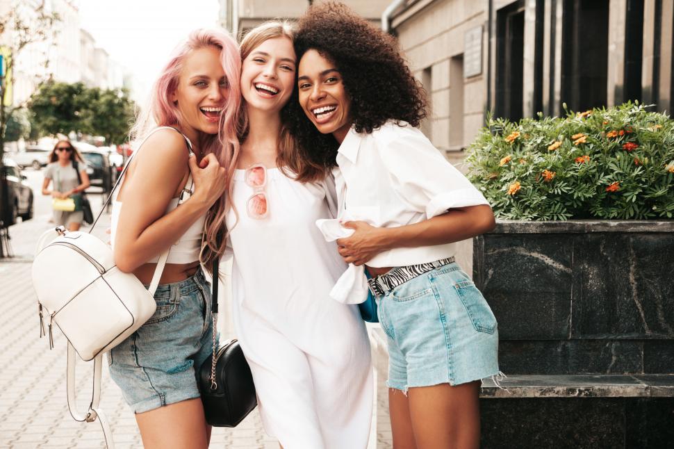 Free Image of A group of women posing for a picture 