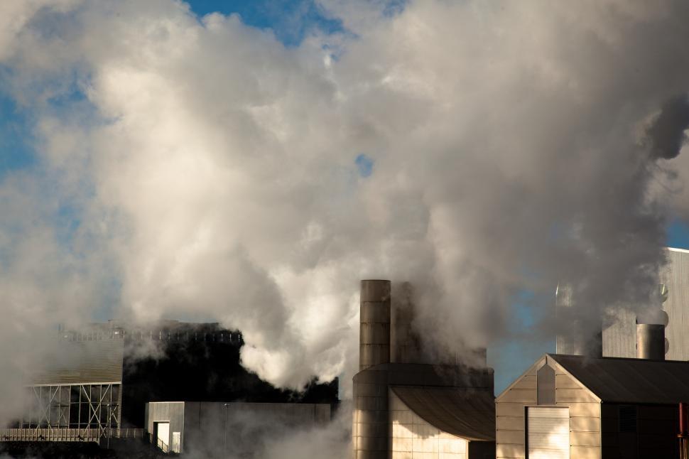 Free Image of Smoke coming out of a factory 