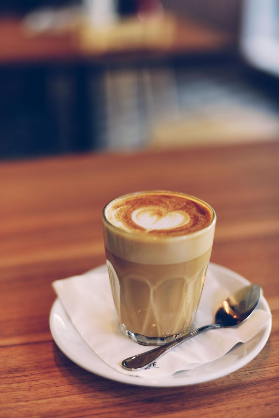 Free Image of Latte art coffee in a glass on table 