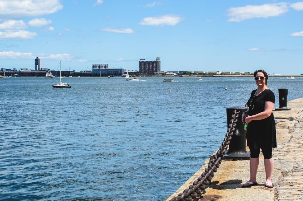 Free Image of Woman by the waterfront 