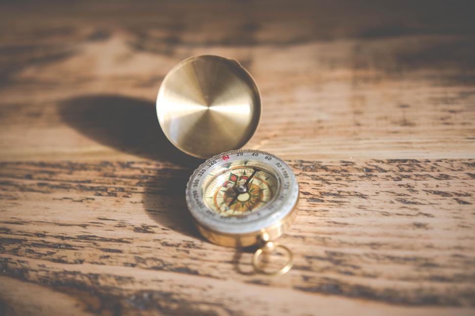 Free Image of Vintage compass on wooden surface 