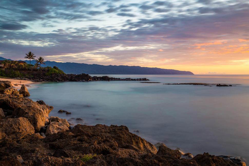 Free Image of Picturesque sunset at rocky tropical beach 