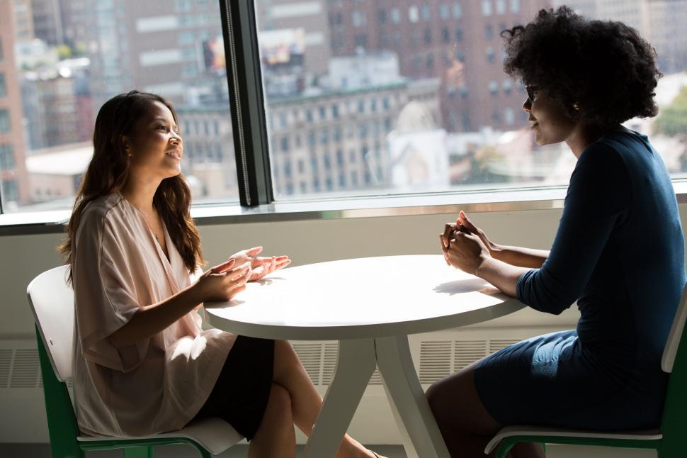 Free Image of Business meeting with a city view backdrop 
