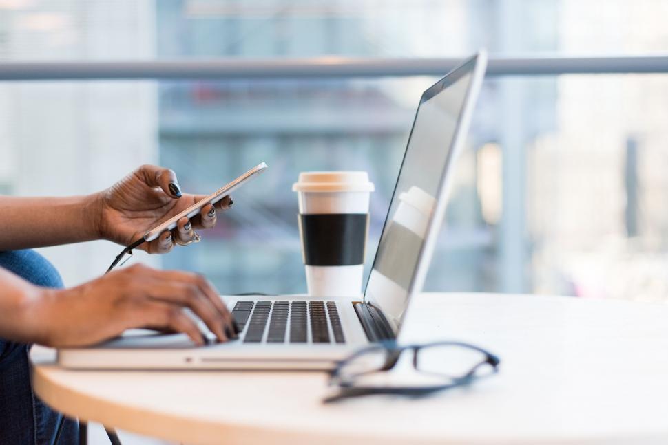 Free Image of Remote work setup with smartphone and laptop 