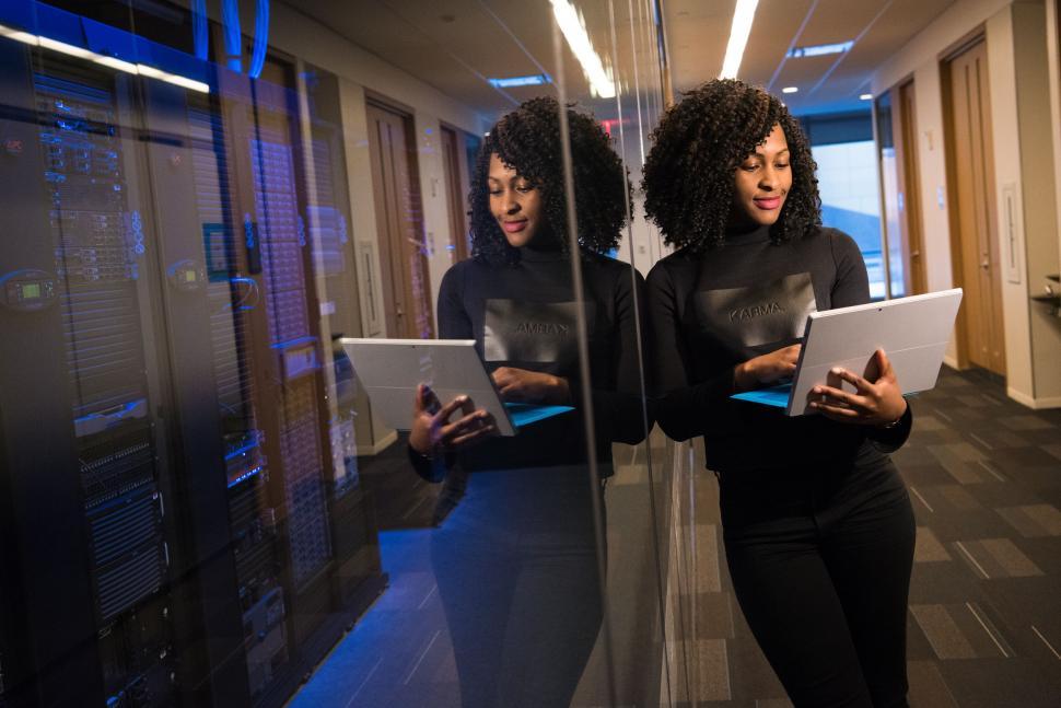 Free Image of Woman with reflection working on tablet 