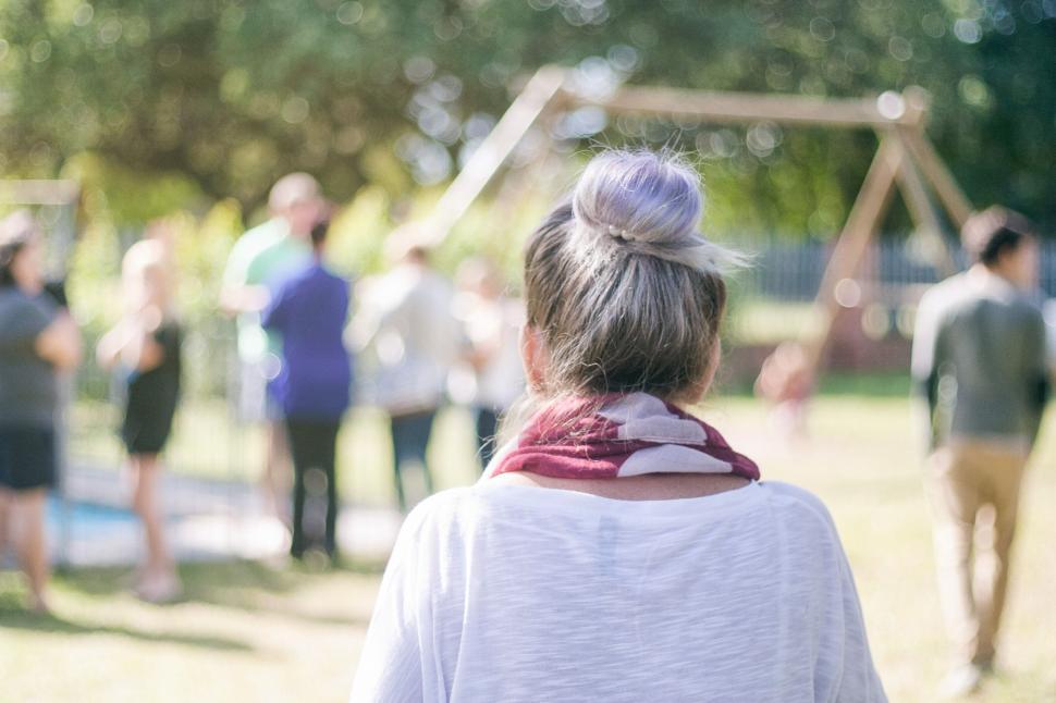 Free Image of Rear view of woman at a sunny gathering 