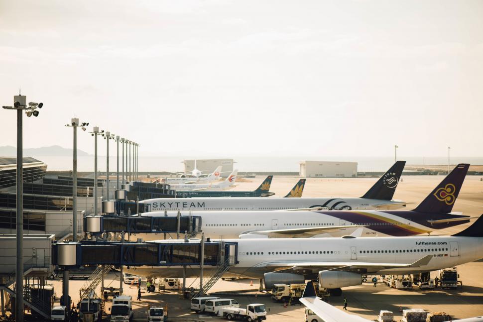 Free Image of Sunset glow on busy airport tarmac 