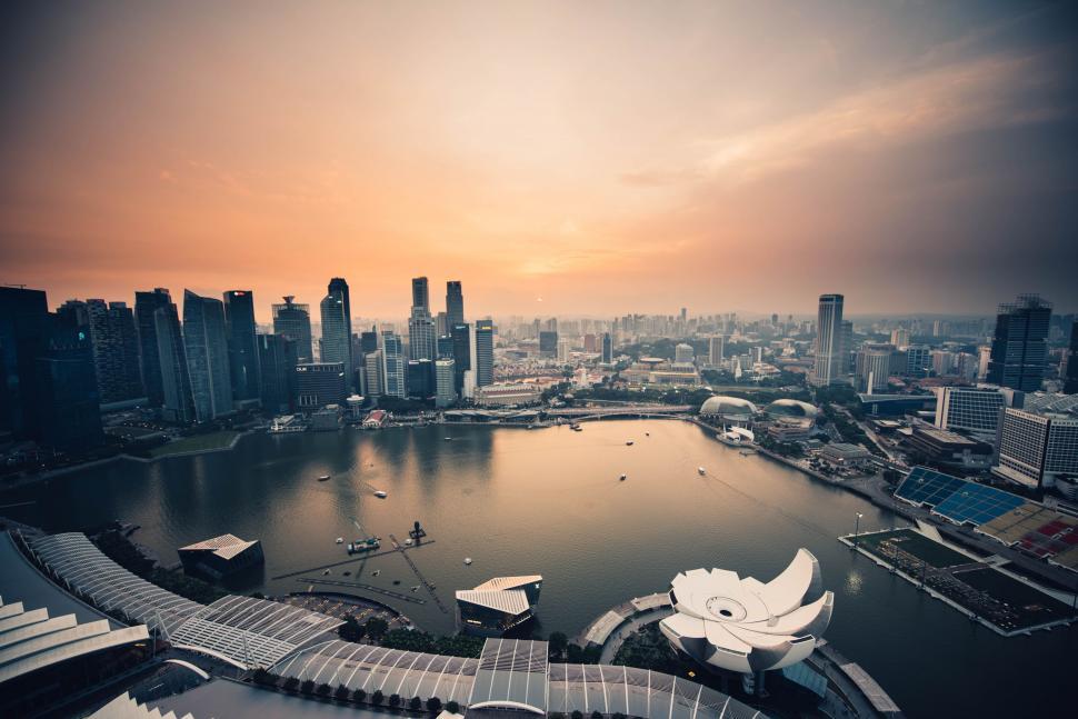 Free Image of Panoramic cityscape during sunset with logo 