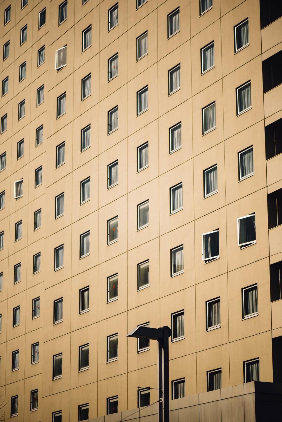 Free Image of Golden Building Facade with Reflective Windows 