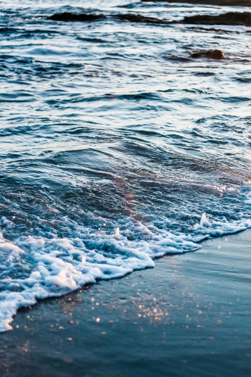 Free Image of Ocean waves gently breaking at twilight 