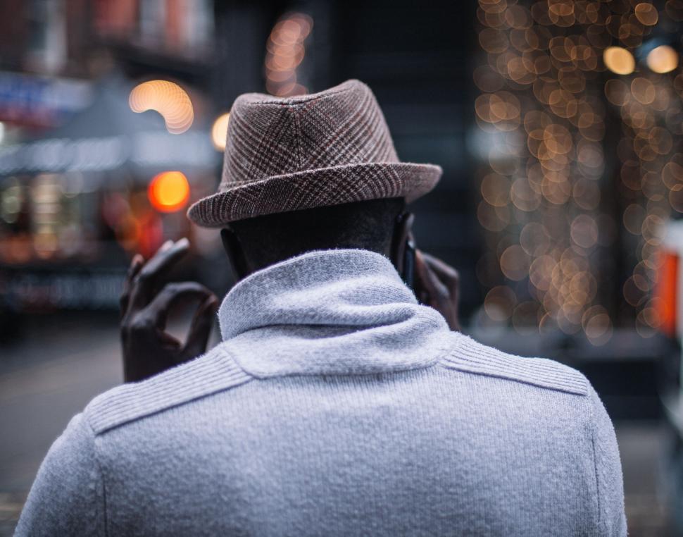 Free Image of Back view of a man with a hat in the city 