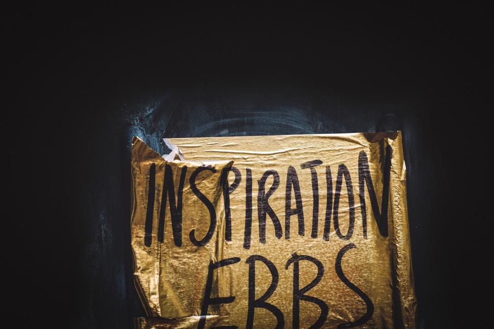 Free Image of Inspirational quote on torn paper on a wall 