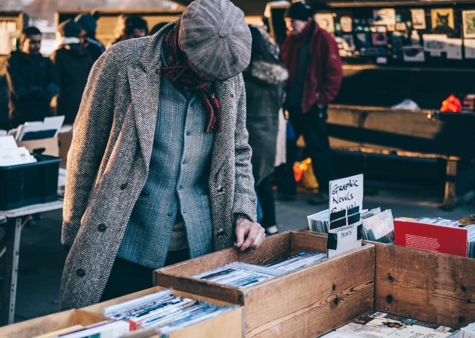 Free Image of Vintage man searching through vinyl records 