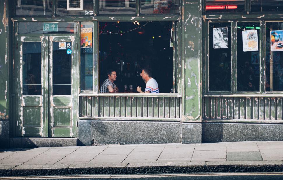 Free Image of Two people dining in a rustic cafe 