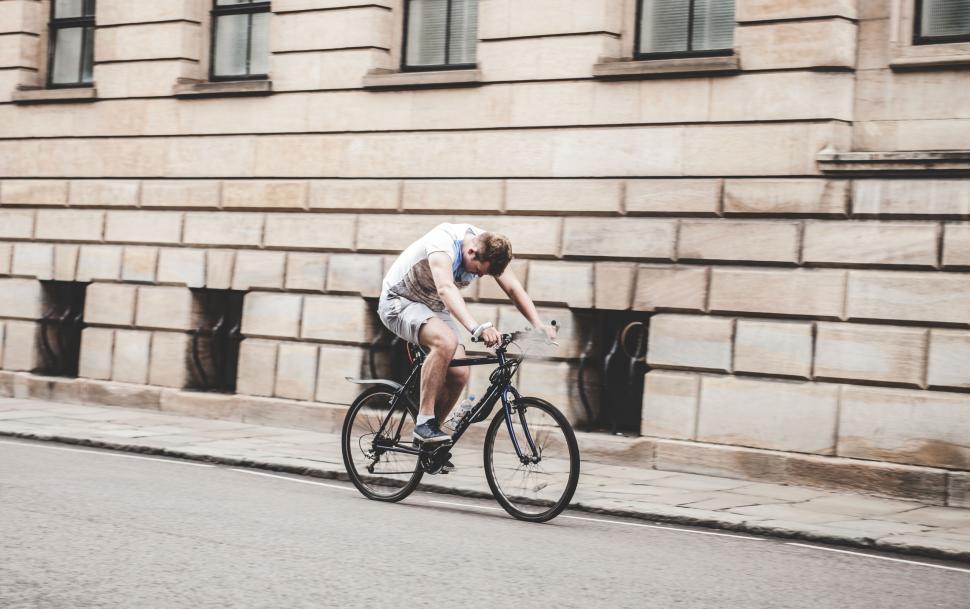 Free Image of Cyclist yawning on the bike ride 