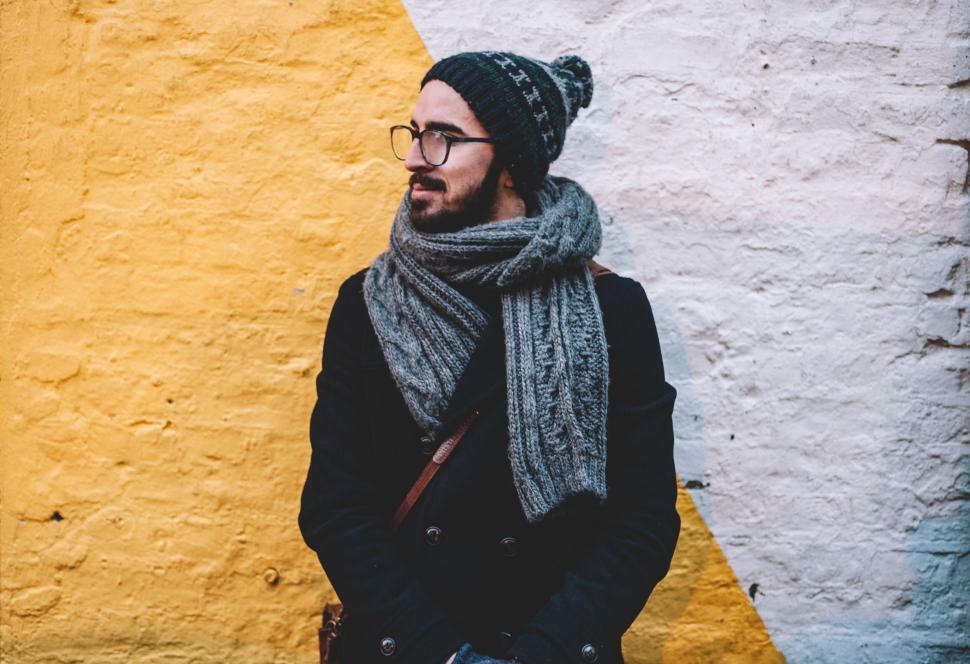 Free Image of Person against yellow and white wall 