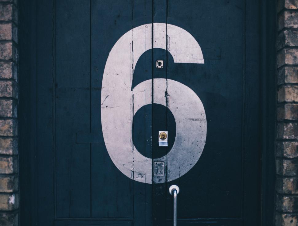 Free Image of Number 6 painted on black wooden door 