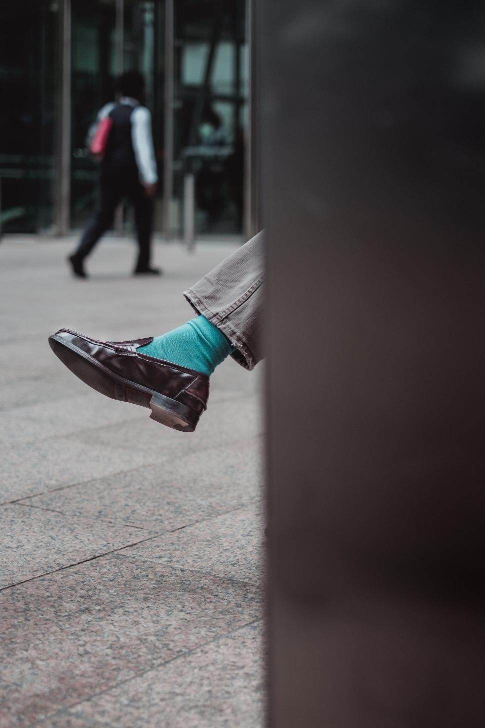 Free Image of Cross-legged person relaxing in urban setting 
