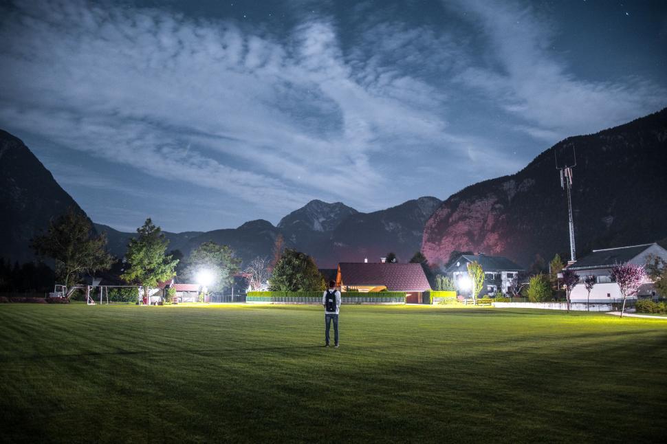 Free Image of Person standing in a field at night 