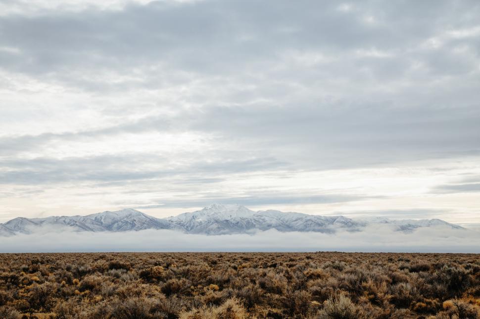 Free Image of Moody mountain range under overcast skies 