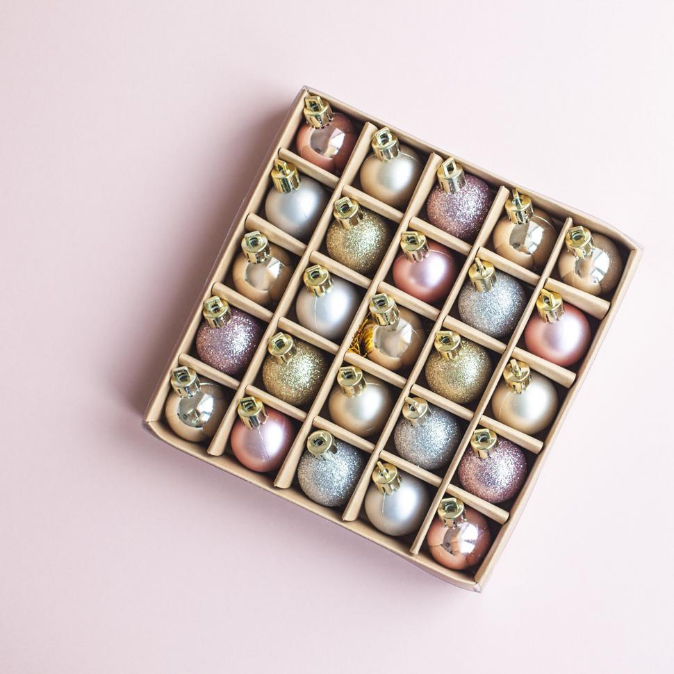 Free Image of Elegant box of Christmas ornaments in soft tones 