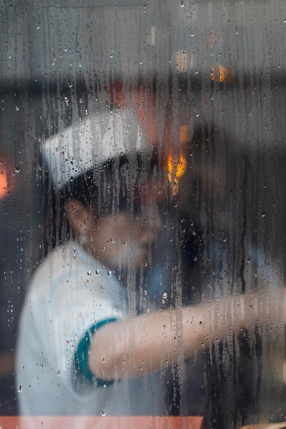 Free Image of Chef in kitchen behind steamy window 