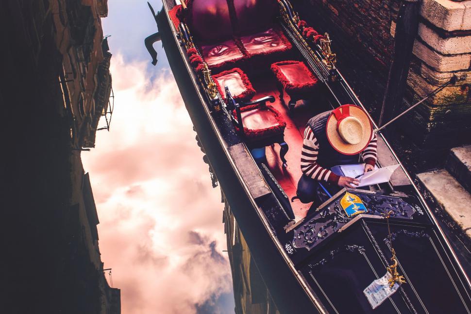 Free Image of Venetian gondola ride in a narrow canal 