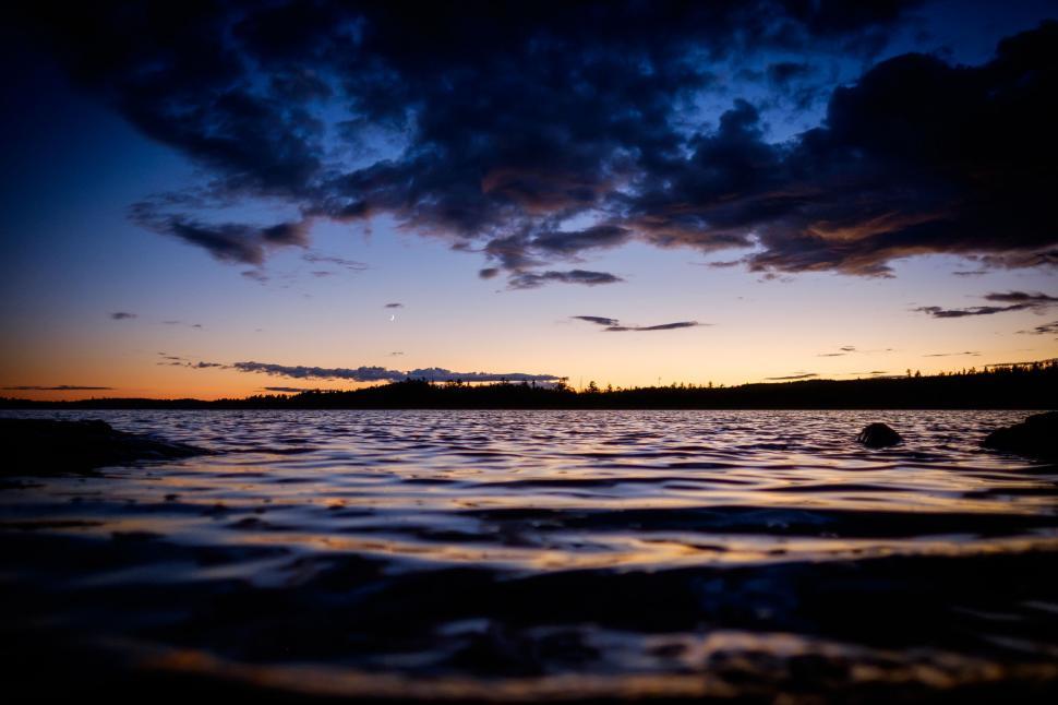 Free Image of Surreal lakeside scene during twilight hours 