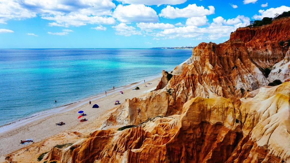 Free Image of Cliffs and beach with ocean view under sun 